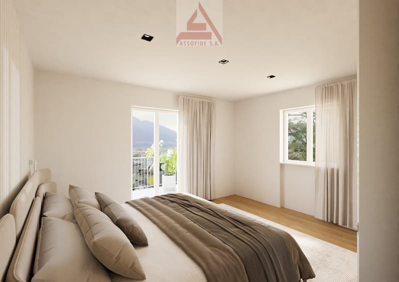 wooden floor, modern decor, large bed, multiple pillows, glass doors leading to balcony with view, large windows with curtains