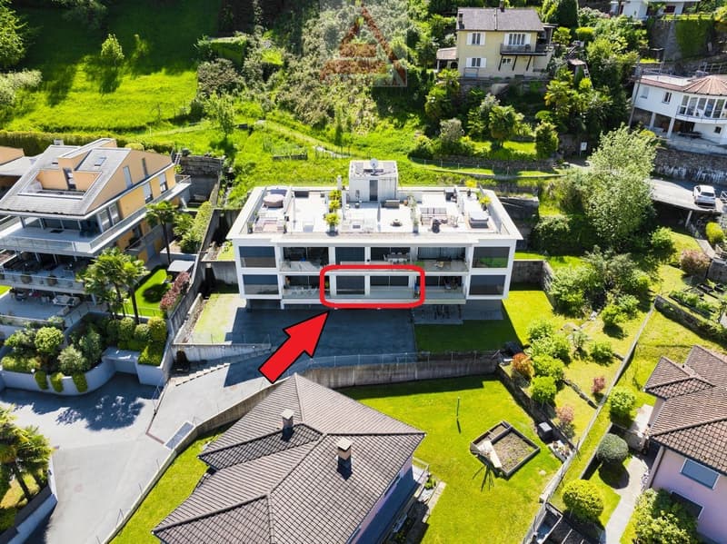 3 story house, white exterior, multiple balconies, swimming pool, garden, parking area