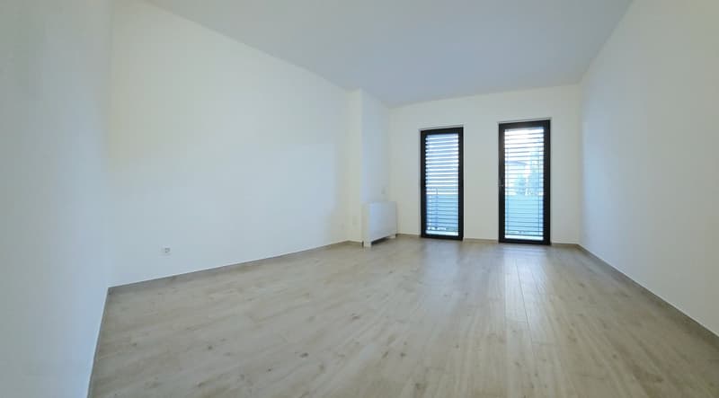empty room, white walls, wooden floors, windows, power outlets