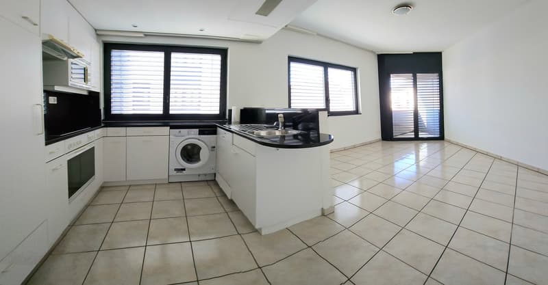 modern kitchen with white cabinets, tiled floor, washing machine, dishwasher, microwave, oven, sink, windows with blinds