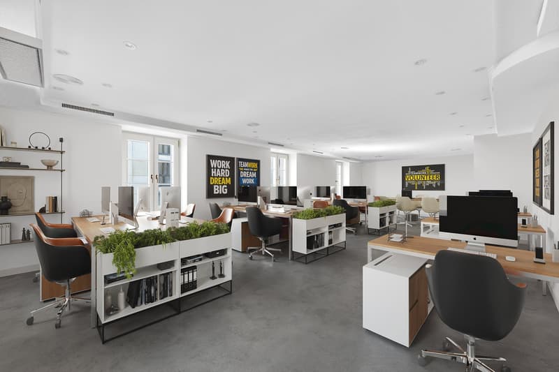 modern office with desks, chairs, plants, monitors, shelves, motivational posters