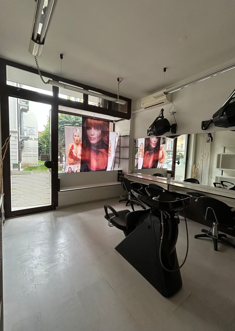 Professional hair salon, white tiled floor, hair washing stations, mirrors, salon chairs, advertising banners on the window, air conditioner
