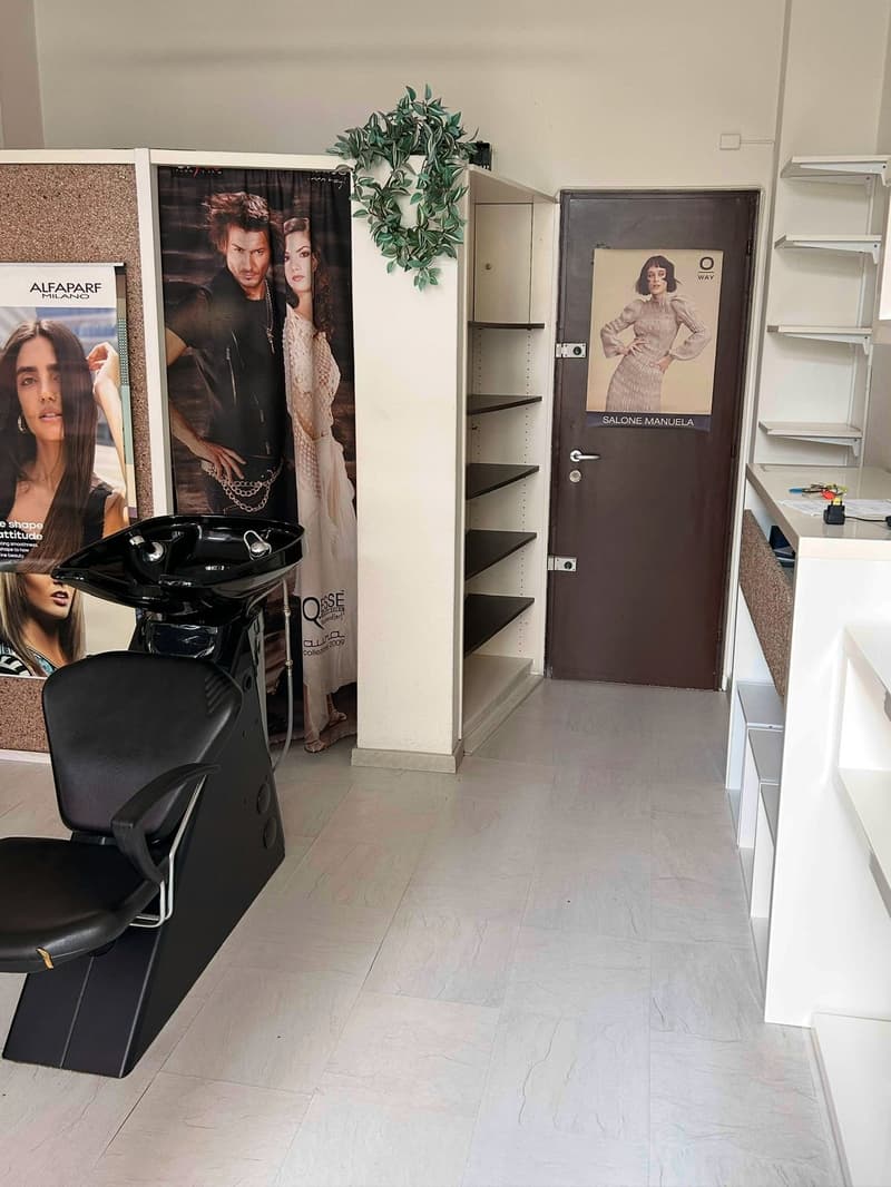 salon chair, sink, cabinet, posters, door