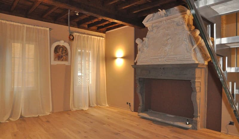Fireplace, wooden floor, white curtains, picture frame