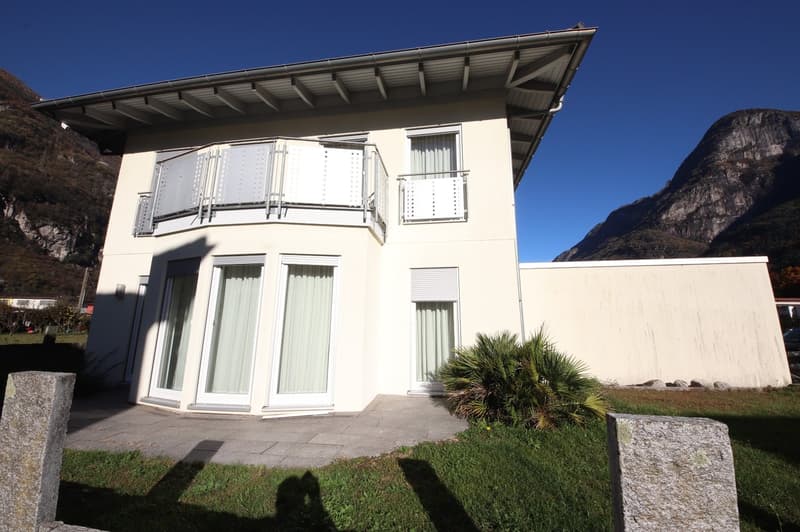 modern white house, balcony, large windows, landscaped garden, nearby mountains