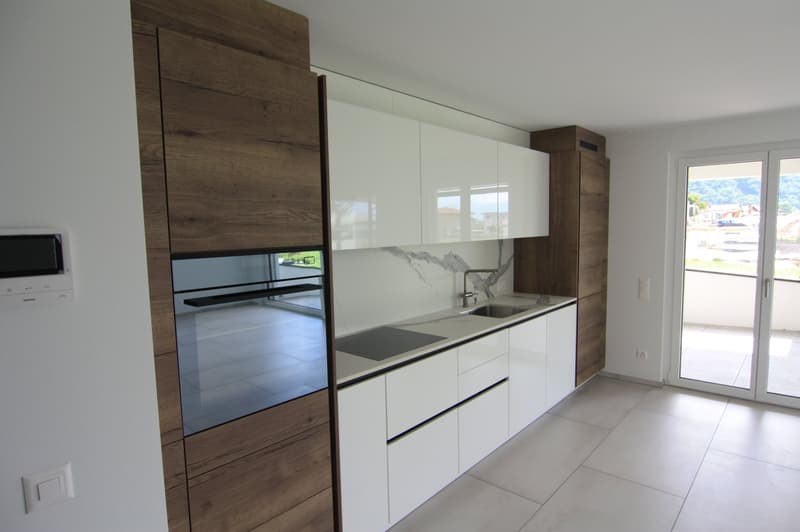 white marble countertop, oven, white kitchen cabinets, tiled floor