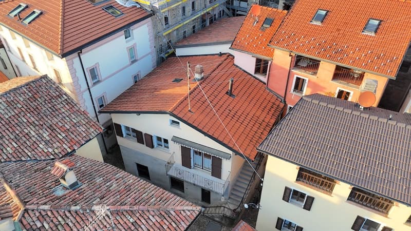multiple roof tops, tiled roofs, windows, balconies