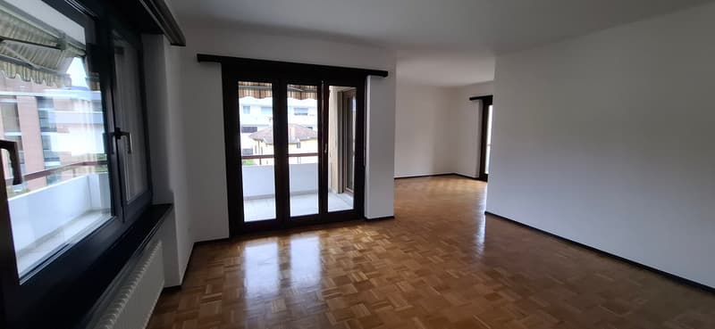 wooden floor, large windows, balcony, sliding doors