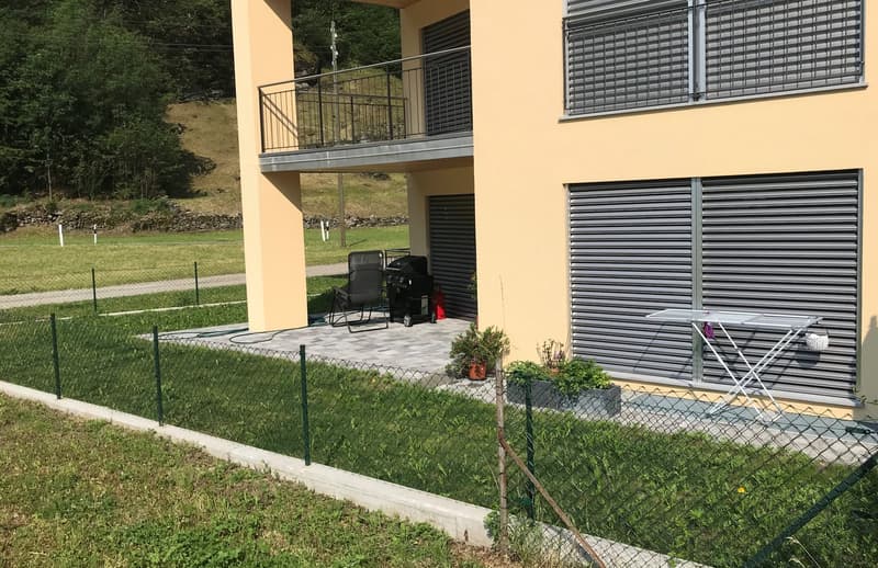 yellow house, balcony, green fence, outdoor BBQ, ironing board