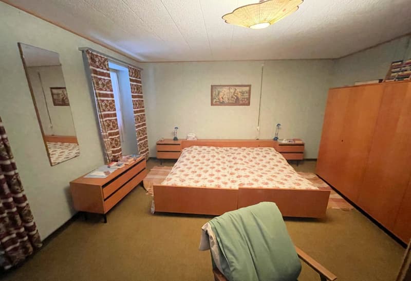 double bed, mirror, two nightstands, wardrobe, chair, rug
