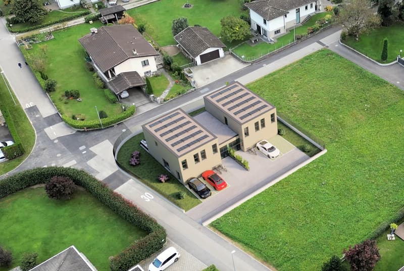 modern house with solar panels, spacious living area, multiple parking spaces