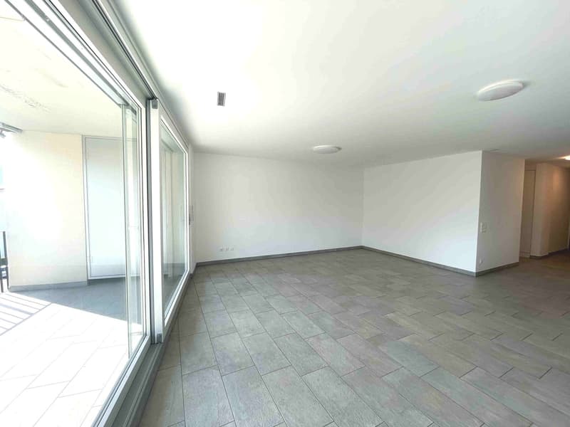 empty room, large windows, sliding glass doors, balcony, tiled floor, white walls