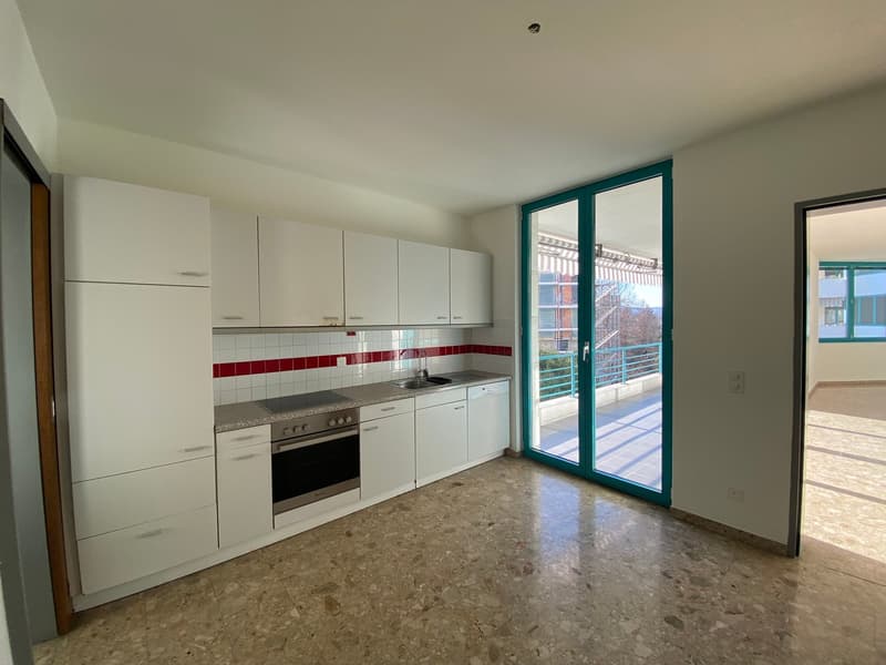 white cabinets, modern kitchen design, gas stove, large windows, balcony with view