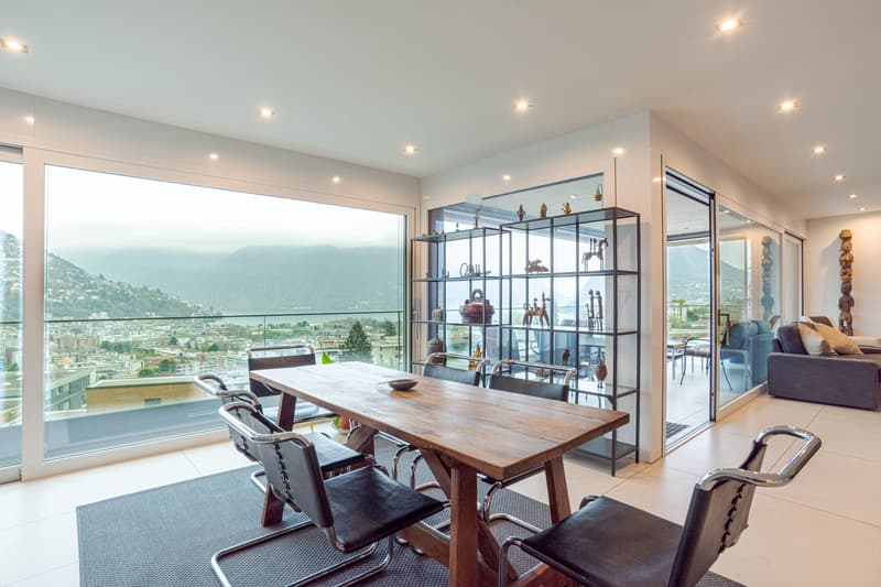 wooden table, chairs, glass windows, glass doors, balcony