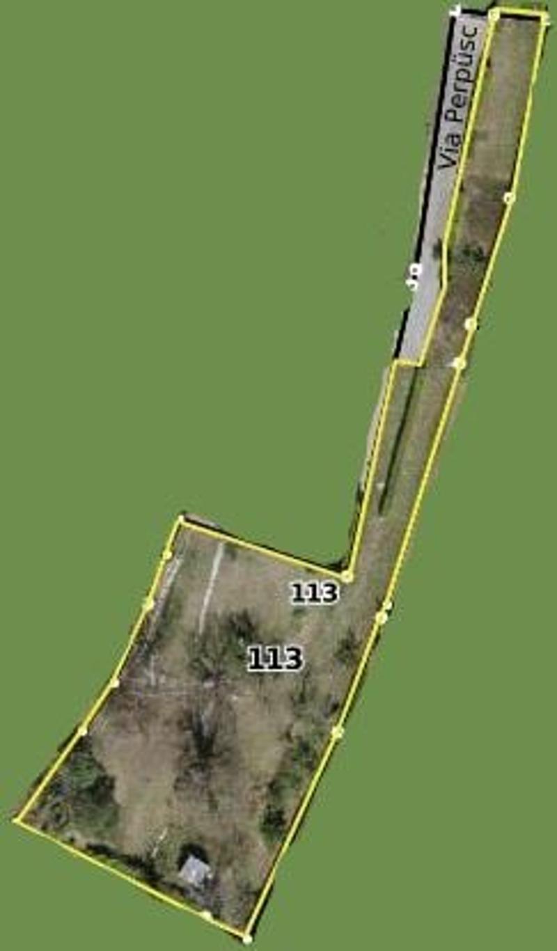 Outdoor lot with a lot number of 113, a building is marked, street named Via Perpuse.