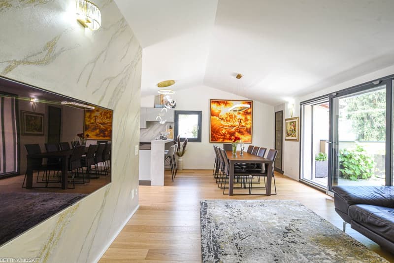 large modern living room, dining room, white walls, wooden floor, large windows, sliding doors