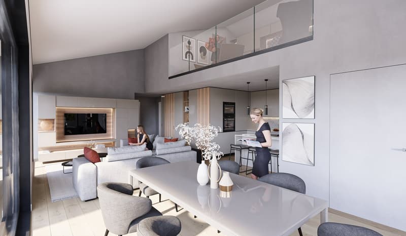 The image shows a modern, open-concept living room and kitchen area. The living room features a large gray sectional sofa, a coffee table, and a wall-mounted TV. The kitchen has sleek white cabinets, a gray countertop, and built-in appliances including a