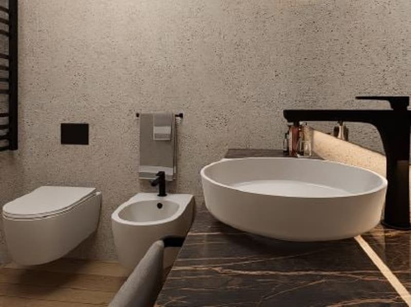 Modern bathroom with a freestanding bathtub, wall-mounted toilet, and minimalist decor
