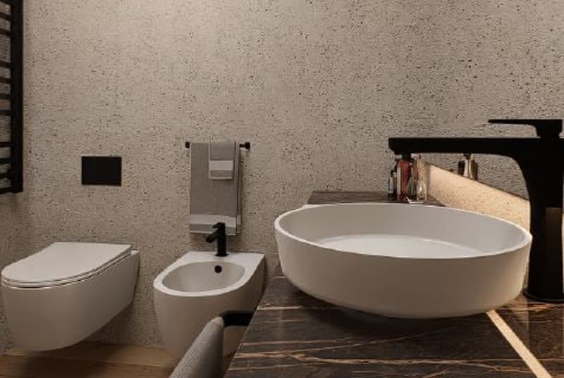 The image shows a modern bathroom with a freestanding bathtub, a wall-mounted toilet, and a sink. The walls have a textured, speckled finish, and the floor appears to be made of wood-like tiles. The overall design has a minimalist and contemporary style.