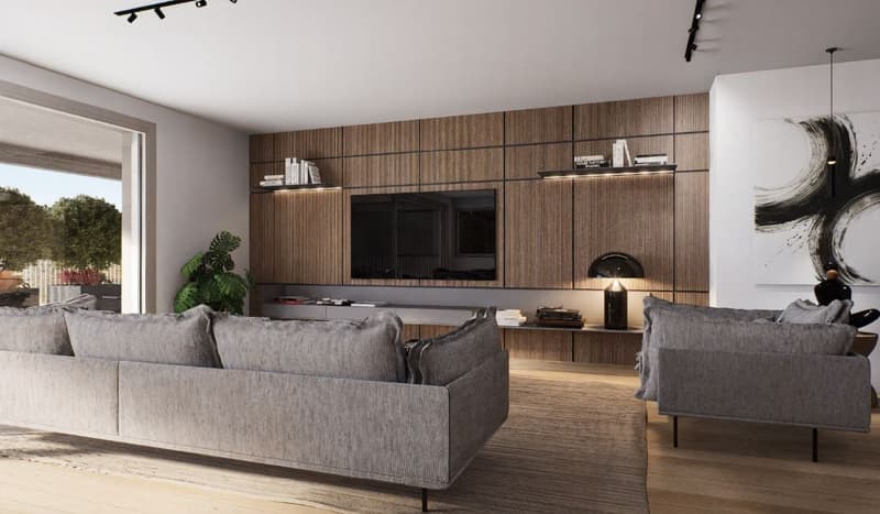 Large living room with wooden paneled wall, gray sofas, shelves, and a view of the balcony through the window
