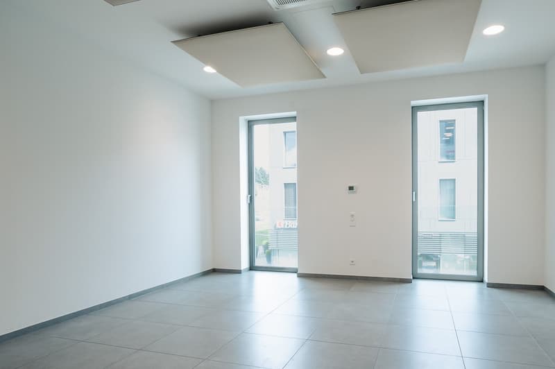 empty room, tiled floor, double glass doors, large windows, white walls