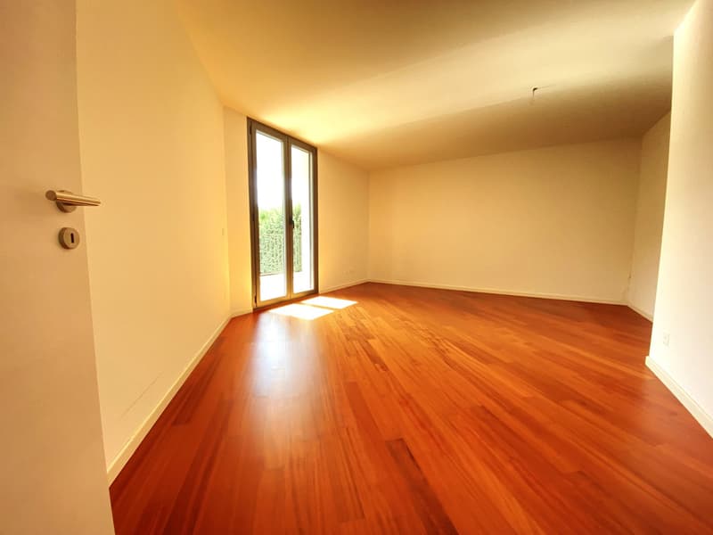 empty room, wooden floor, sliding glass door, bright light