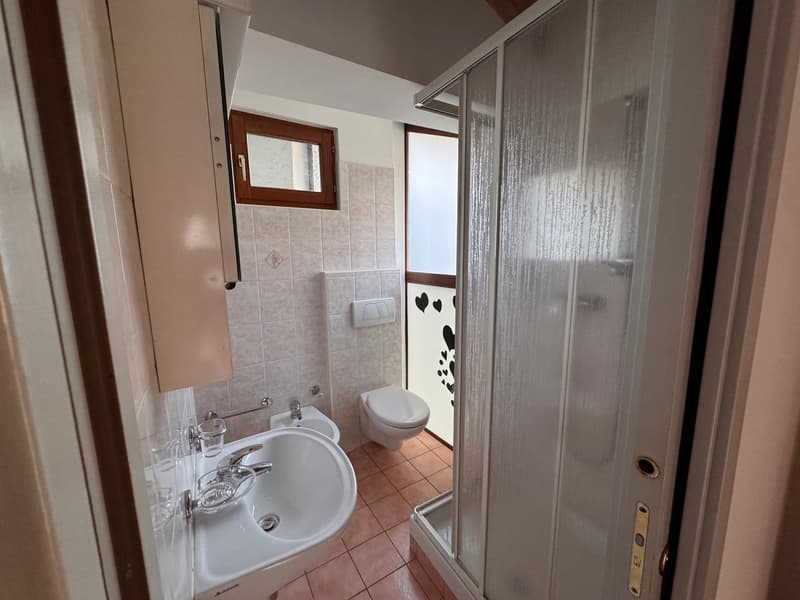 modern bathroom with bathtub, sink, bidet, and shower cubicle