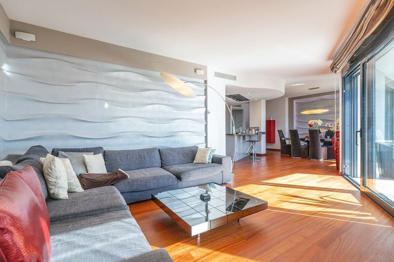 modern design, gray sofa, glass coffee table, wooden floor, large windows, balcony