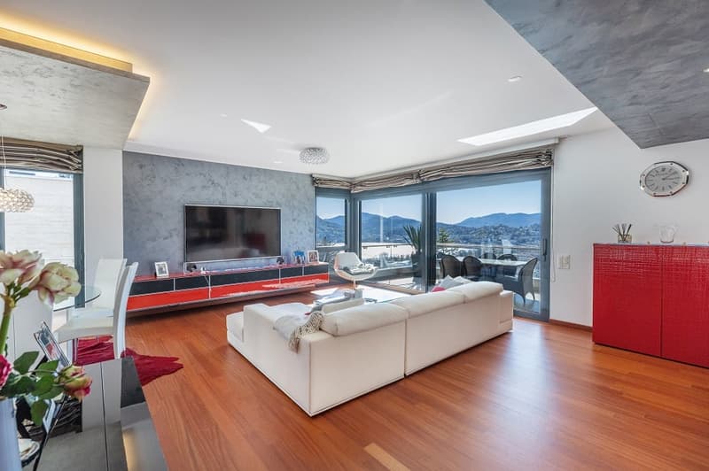 modern living room, white sofa, wooden floor, large windows, TV, red cabinet, dining table, flowers