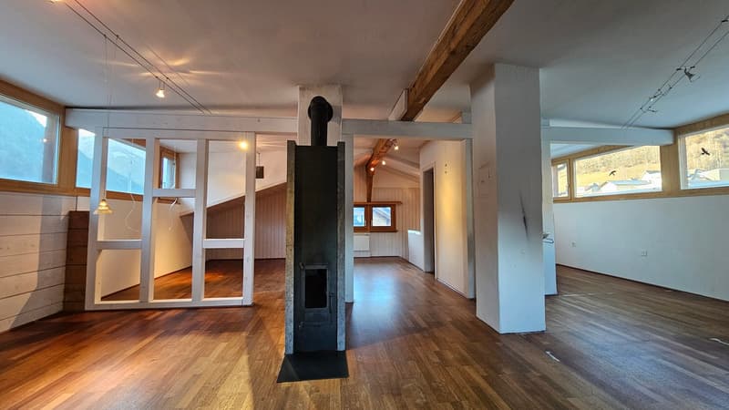 empty room, wooden floor, high ceiling, fireplace, sliding doors, large windows, large beams