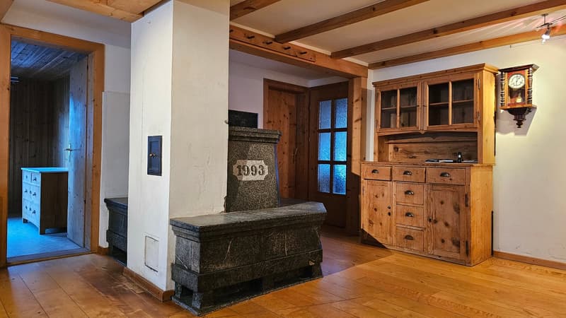wooden cabinets, wood flooring, wooden fireplace, wooden pillars, door