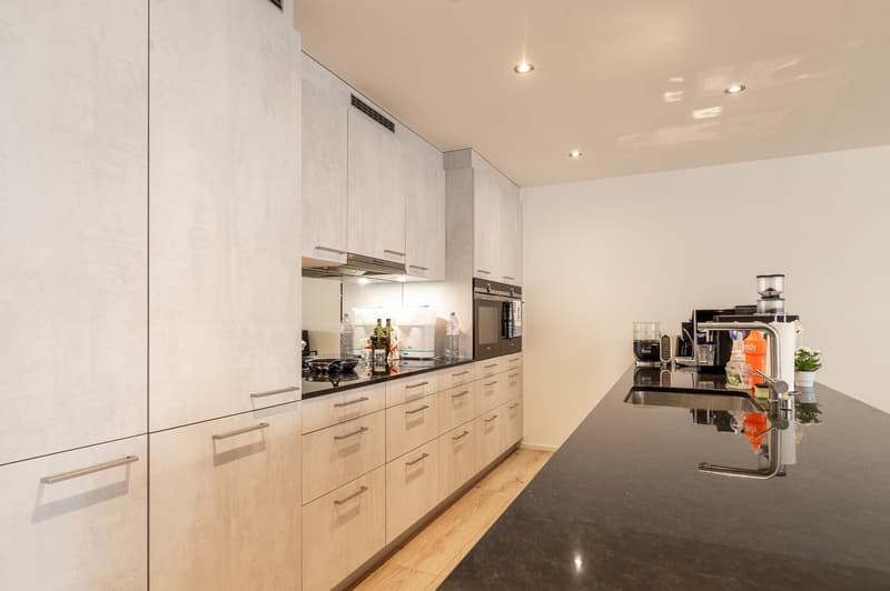 modern kitchen, granite countertops, stainless steel appliances, wooden floor, white cabinets, under cabinet lighting