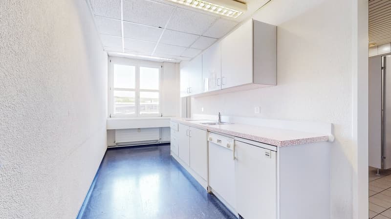 a fully fitted modern kitchen with washing machine and dishwasher
