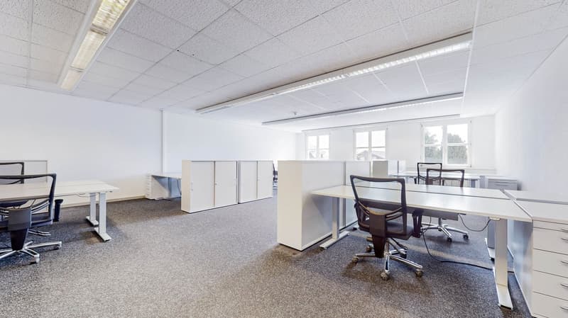 office interior with white tables, chairs, cabinets, carpet, windows