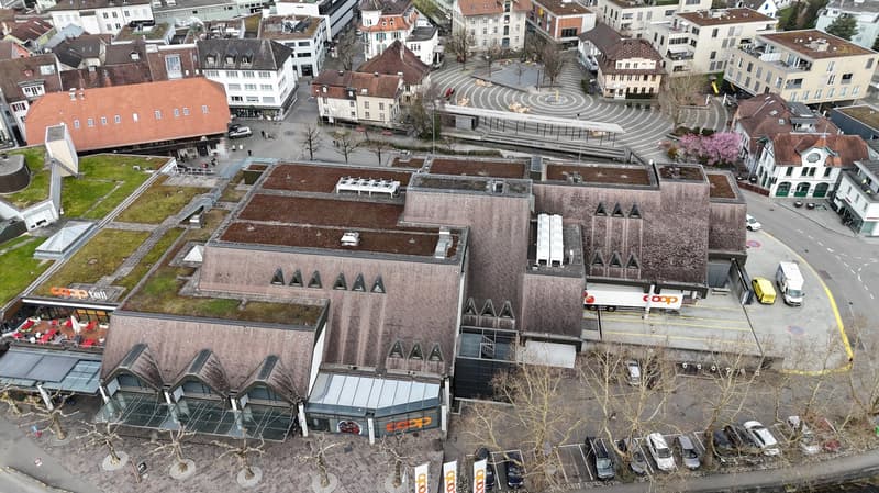 modern architecture, flat rooftop, multi-level building, cars parked in front