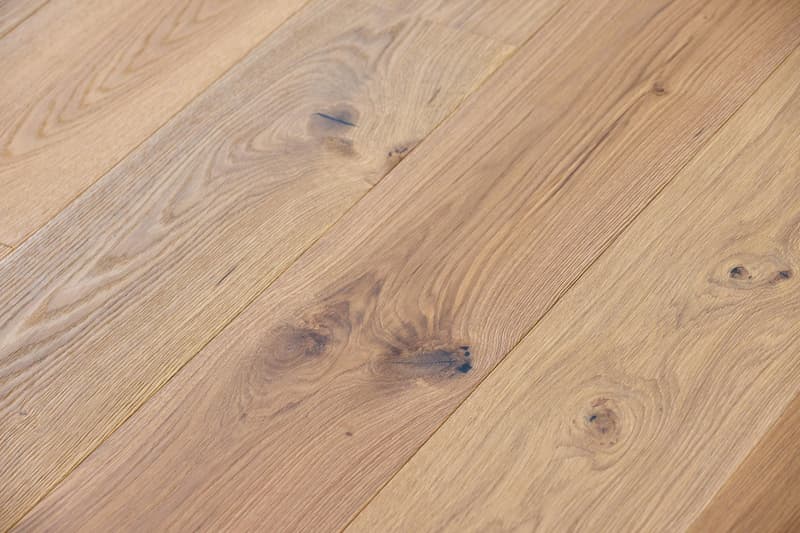Close-up of wooden hardwood flooring with natural grain and some knots