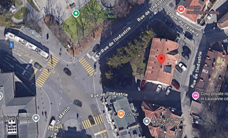 The image shows a map of a city street intersection, with various landmarks and buildings labeled. The streets visible include Rue de l'Industrie and Rue de Verdaine. There is a city stadium or park labeled 'City stade du parc de la place du Nord', as wel