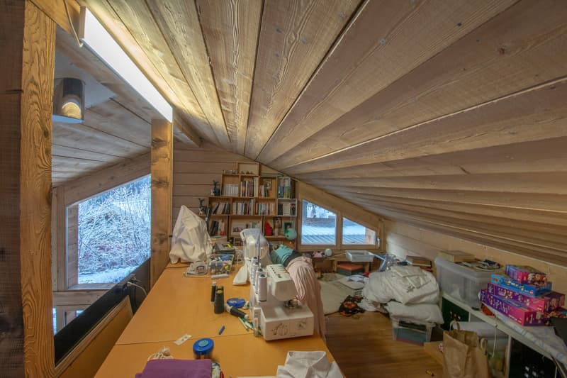 Workroom in attic, sewing machine, shelf, boxes, bags