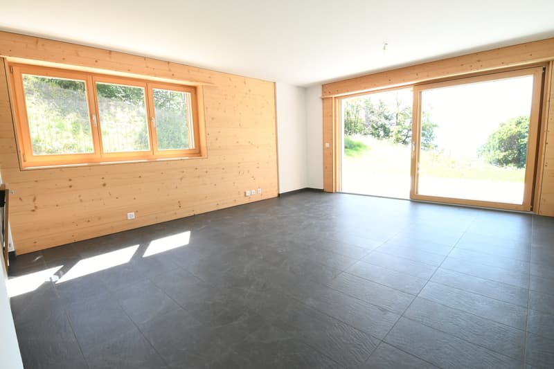 large windows, sliding glass doors, wood paneled walls, tiled flooring
