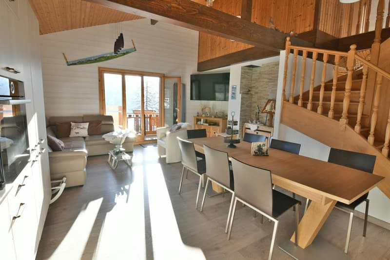 wooden ceiling, modern living room, dining area, glass windows, open staircase, kitchen, couch, TV, table, chairs, cabinet, lamp, rug, and picture