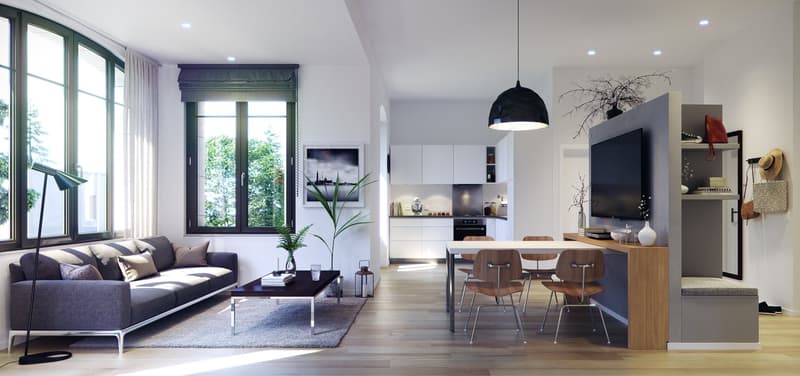 Spacious open-plan living area with large windows, grey sofa, coffee table, dining table and chairs, modern kitchen, and wall-mounted TV