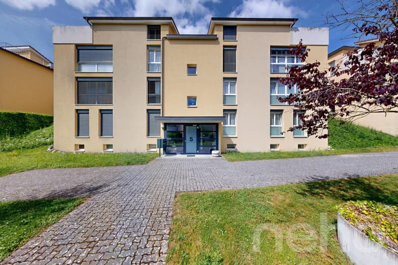 Duplex contemporain de 5,5 pièces avec jardin à Cortaillod (1)