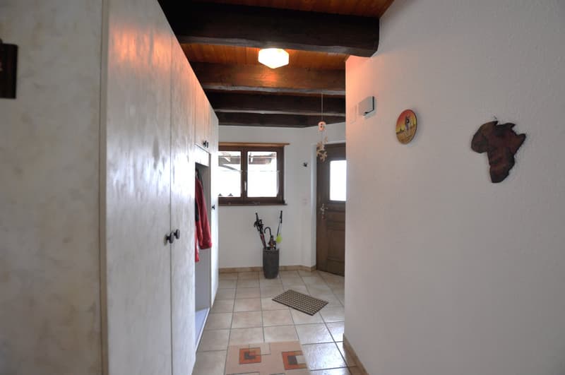 tiled floor, closet, closed window, open door, umbrellas in a vase, wooden ceiling