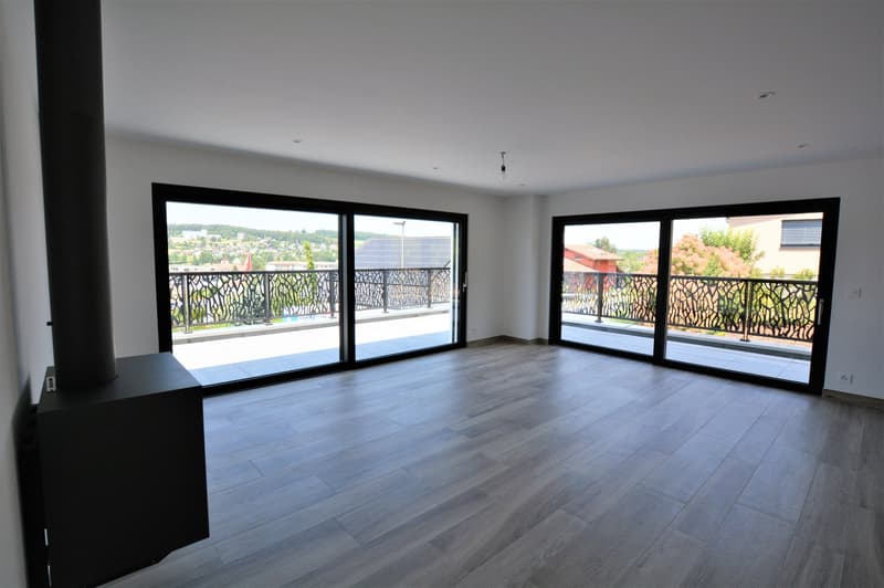Empty room, sliding glass doors, balcony, wooden floor, white walls, modern design