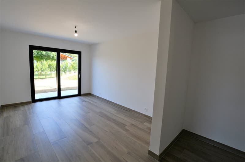 Wooden floor, white walls, sliding glass door, balcony access, ceiling light