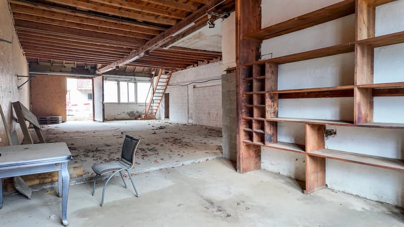 empty room, wooden floor, wooden shelves, chair, desk, wooden ceiling, open door, windows