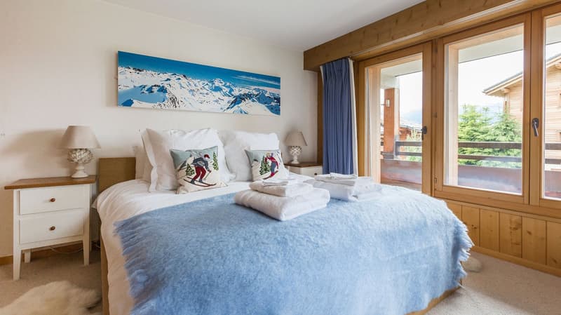 King size bed, mountain painting, double doors to balcony, double lamps, wooden night stands