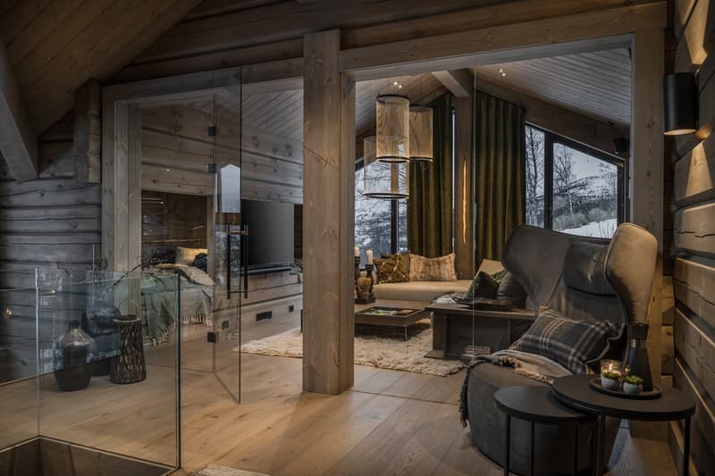 wooden floor, open design, wooden walls, glass wall, cozy lounge area, fireplace, chandelier, modern TV