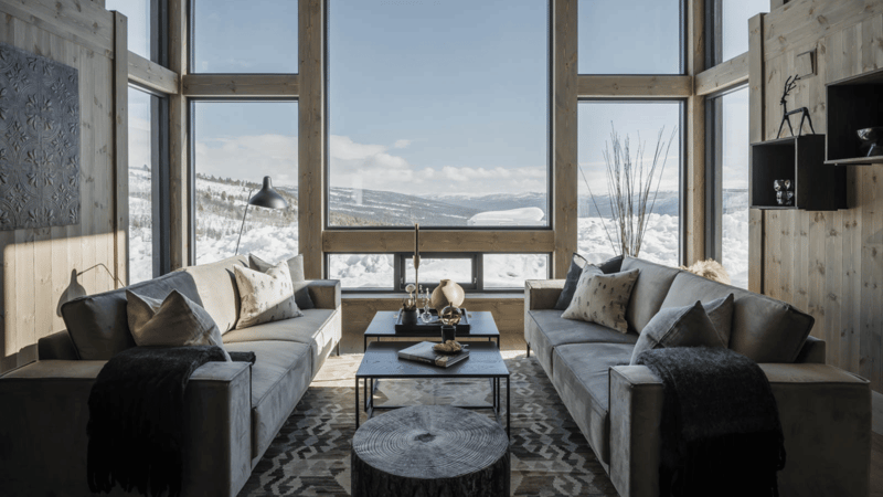 wooden wall, two sofa, two coffee table, large window, carpet, winter landscape view
