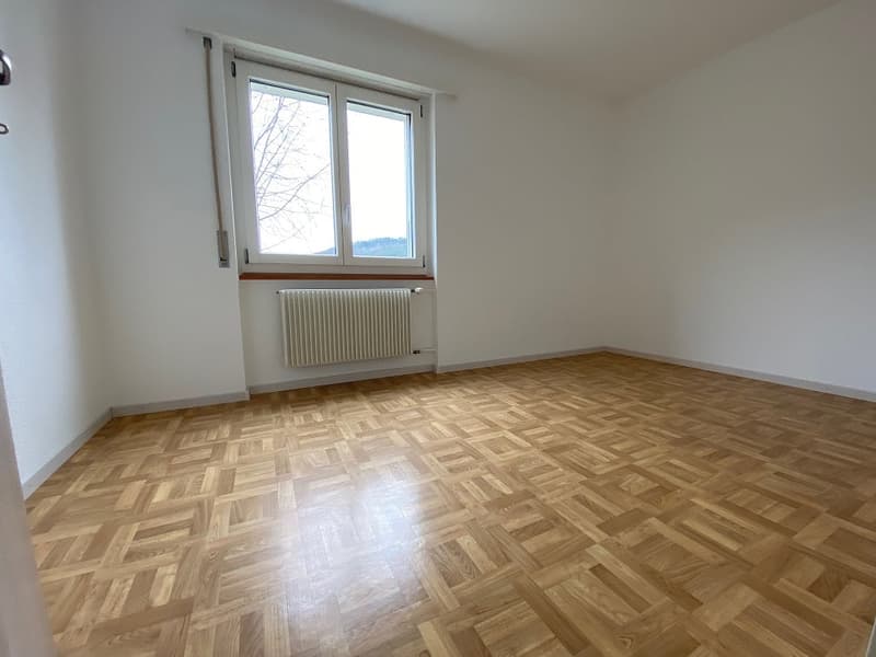 empty room, hardwood floor, white walls, large window, radiator